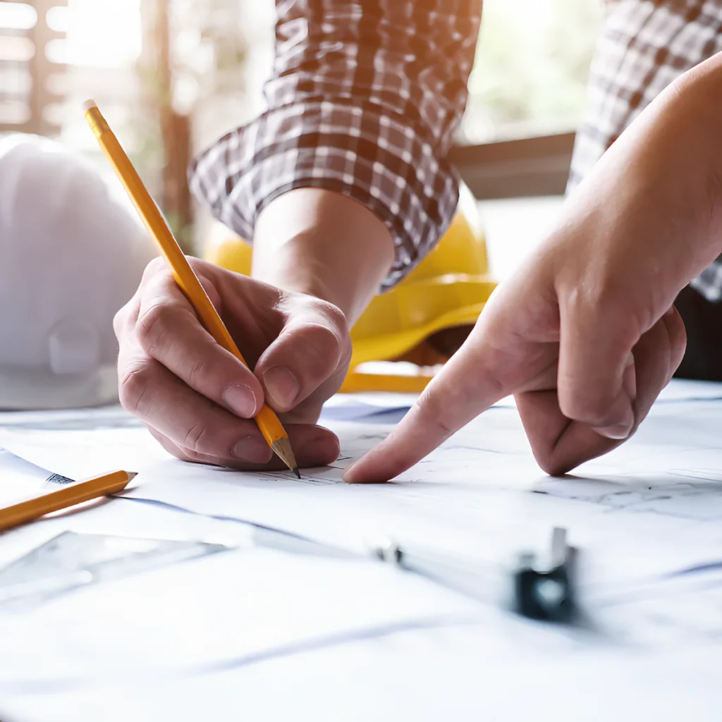 Image of a person showing a custom project plan for their home to a client.