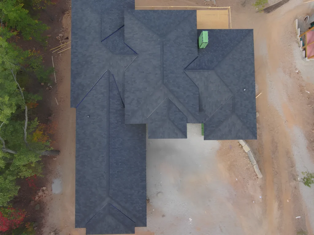 This image is showing a complex shingle roof on a Lake Ozark construction site.