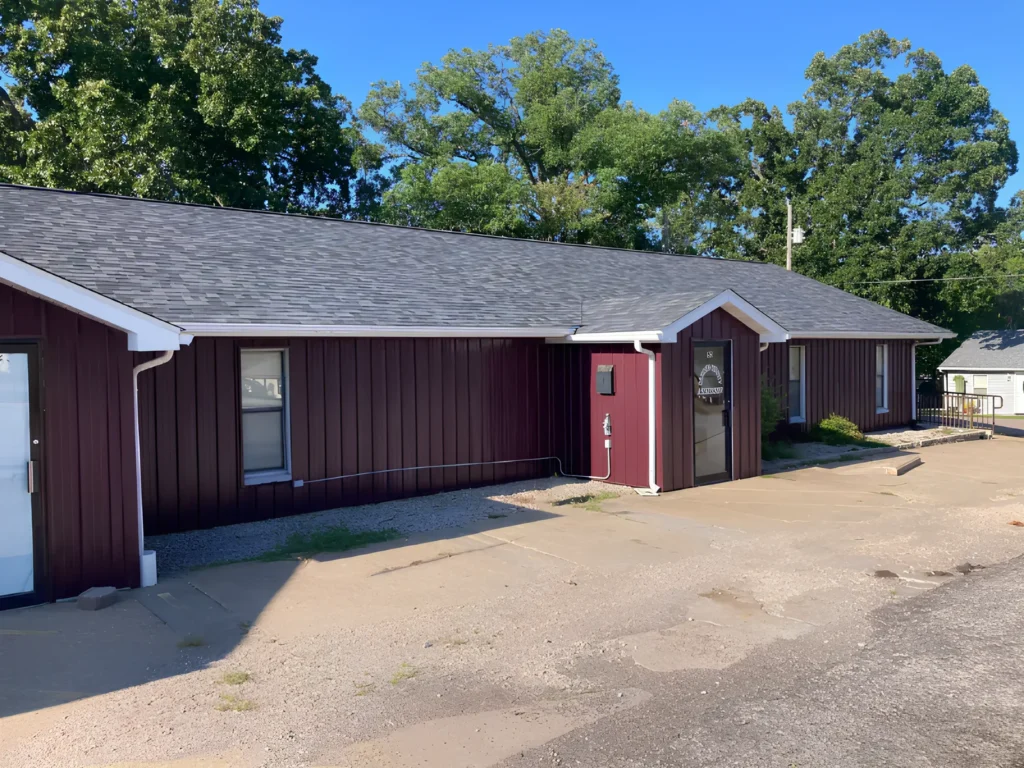This image is showing a shingle roof on a Lake Ozark salon building.