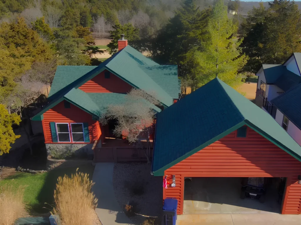 This image is showing log-style homes with green roofs in Lake Ozark residential area.