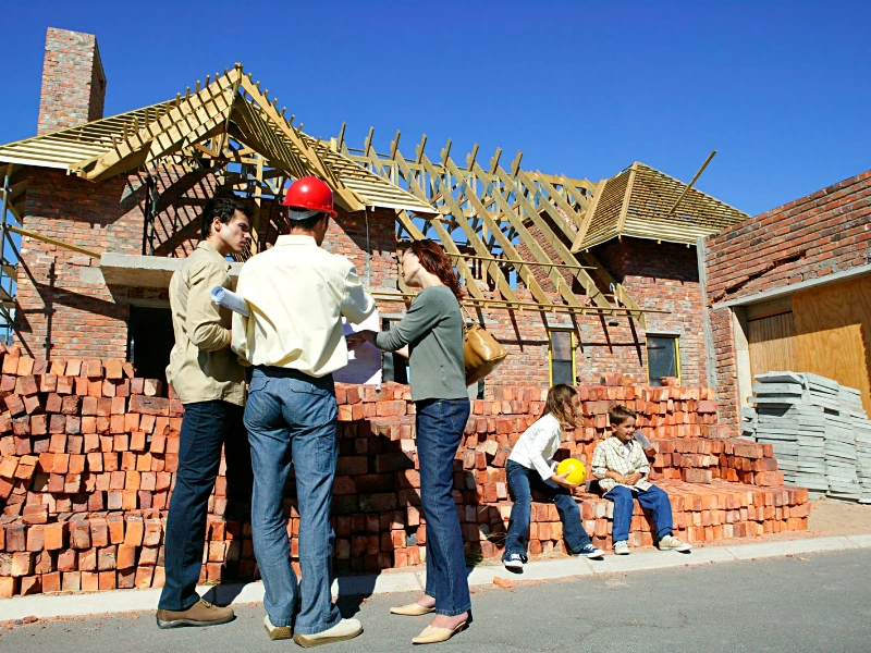 Image of a homeowner discussing other roofing materials with a contractor.
